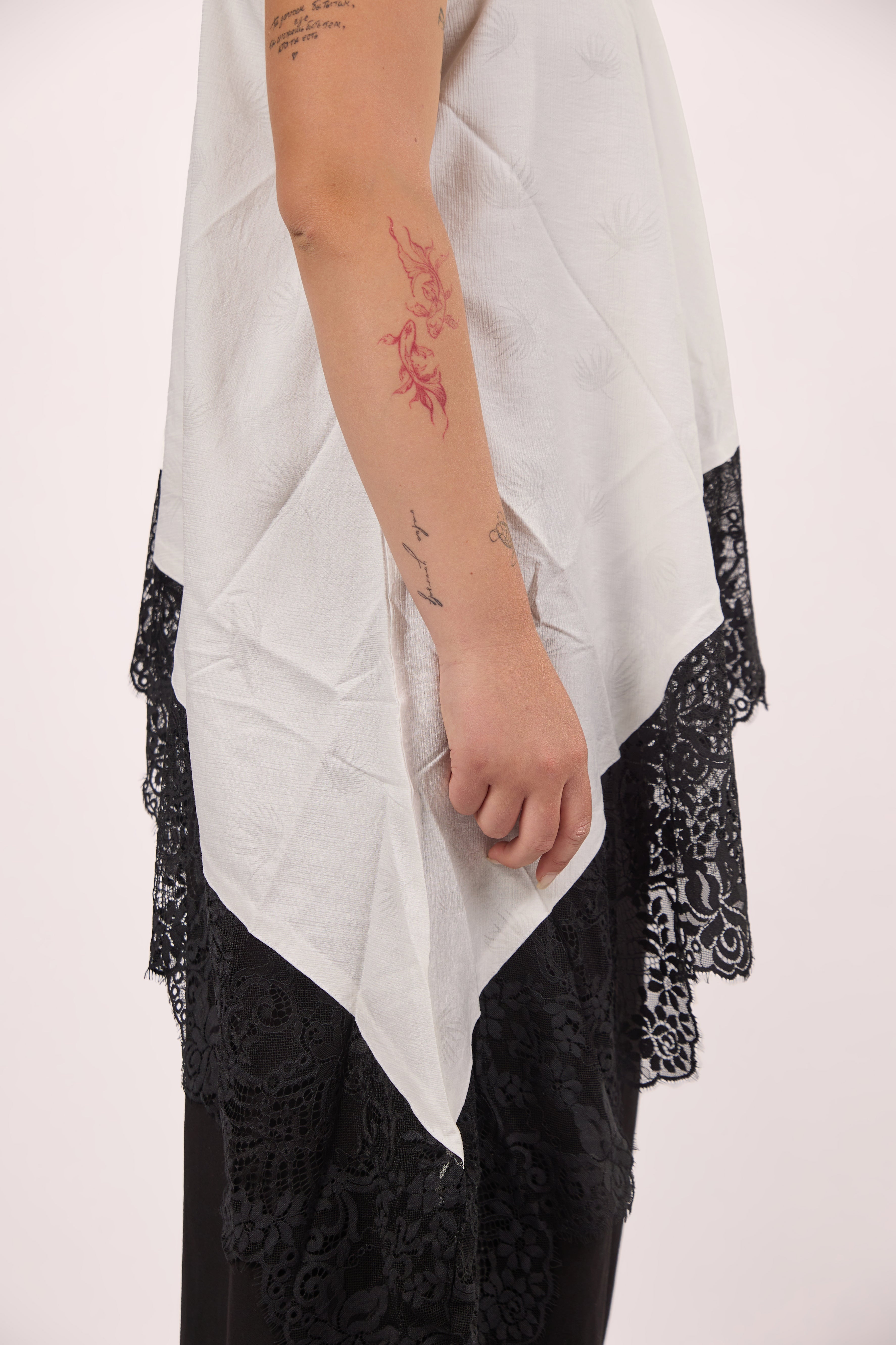 Asymmetrical white lace top
